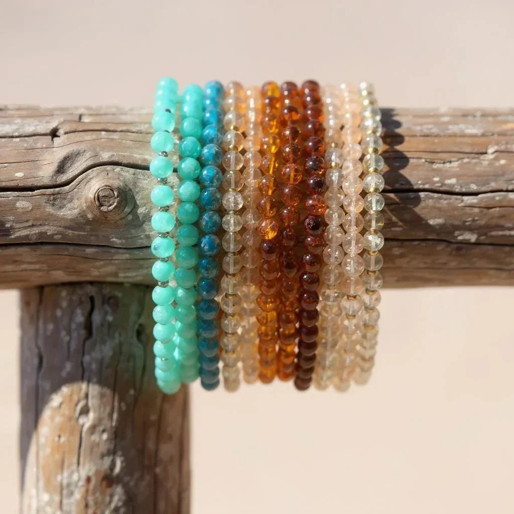 Latatva colorful gemstone beaded bracelets on rustic wood outdoors